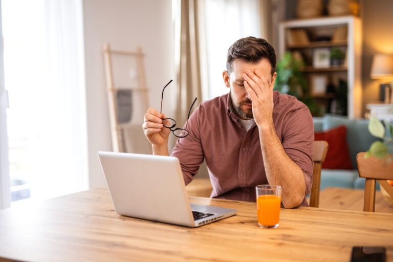Businessman,Office,Working,Holding,Sore,Head,Pain,From,Desk,Working